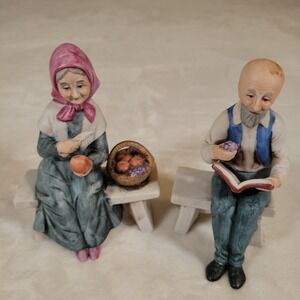 Porcelain Figurine Grandmother sitting on Bench with Fruit Basket Pealing Apples